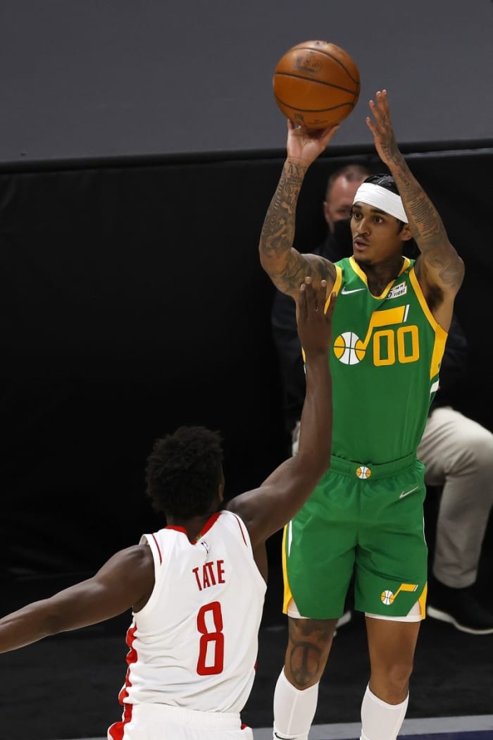 Jordan Clarkson (00) drills a three pointer against the Houston Rockets